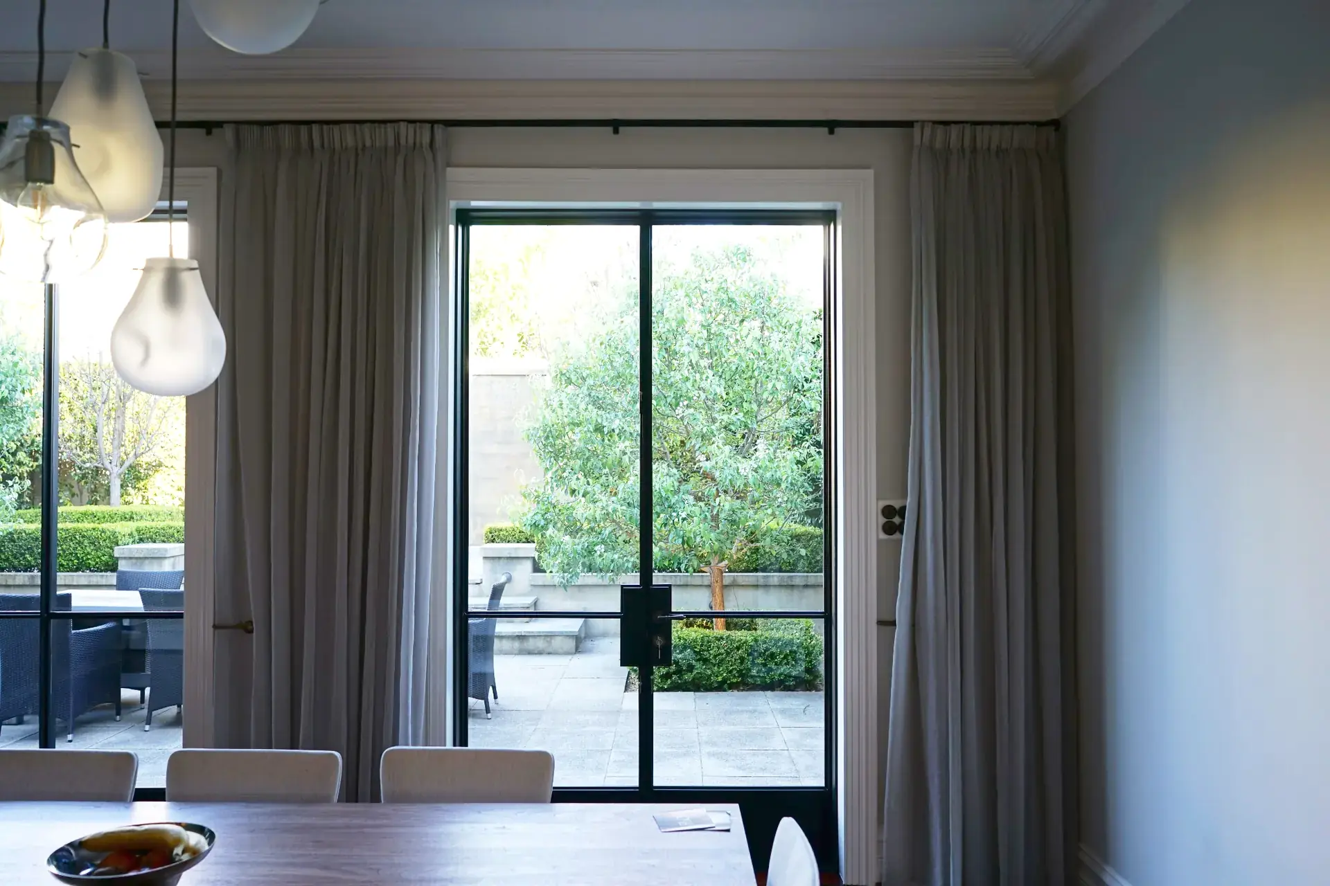 Dining area with sheer curtains and natural light in Nedlands residence, Perth