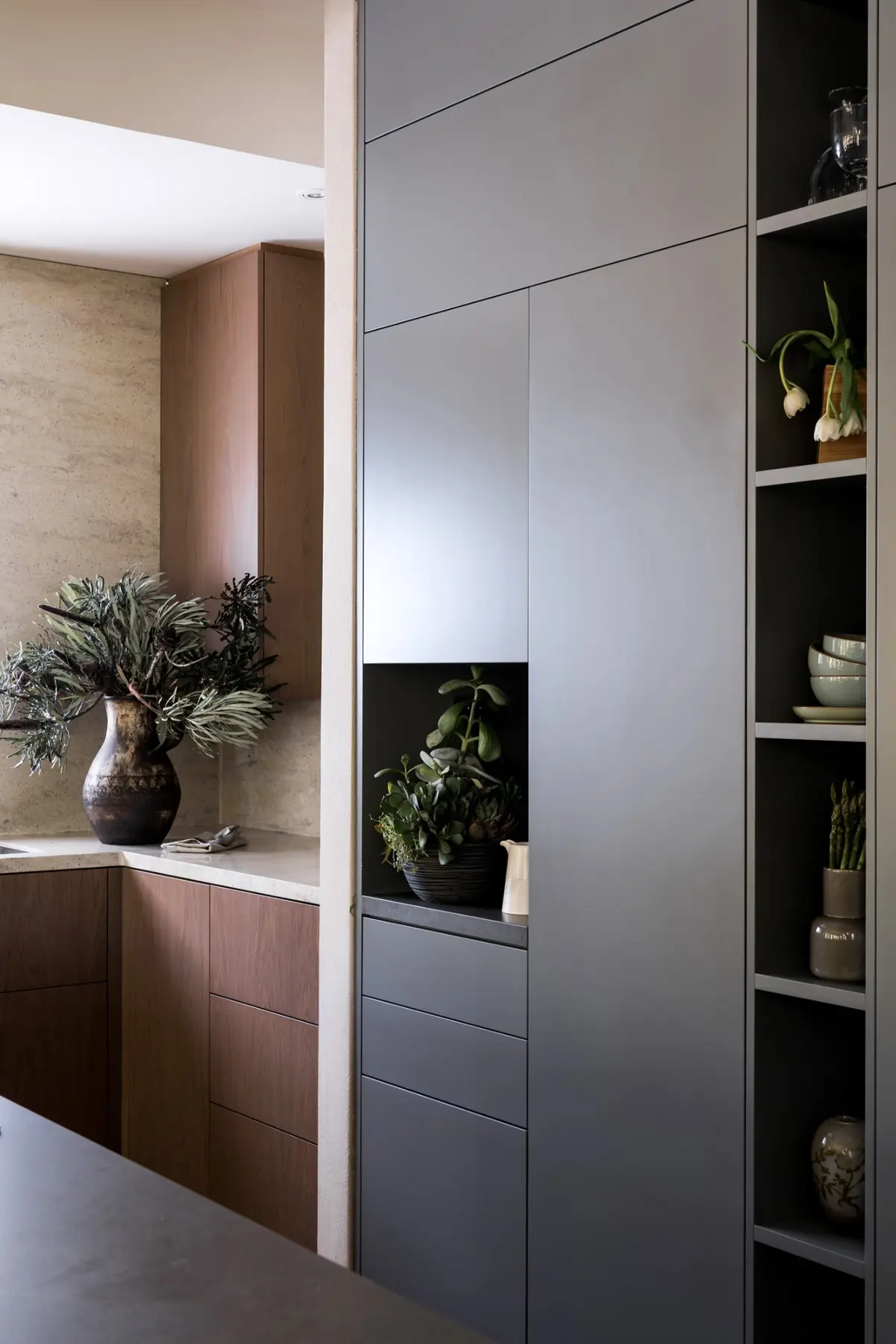 Kitchen cabinetry with mirror feature in Cottesloe residence, Perth