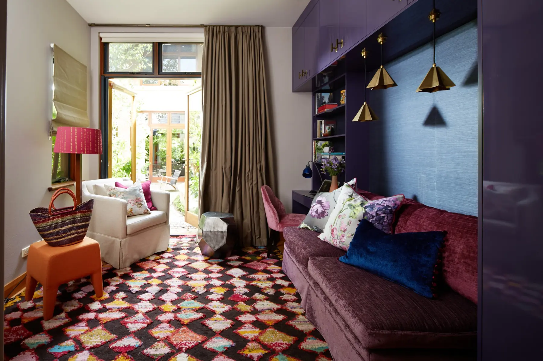 Sitting room with patterned rug and armchair in Cottesloe residence, Perth interior design