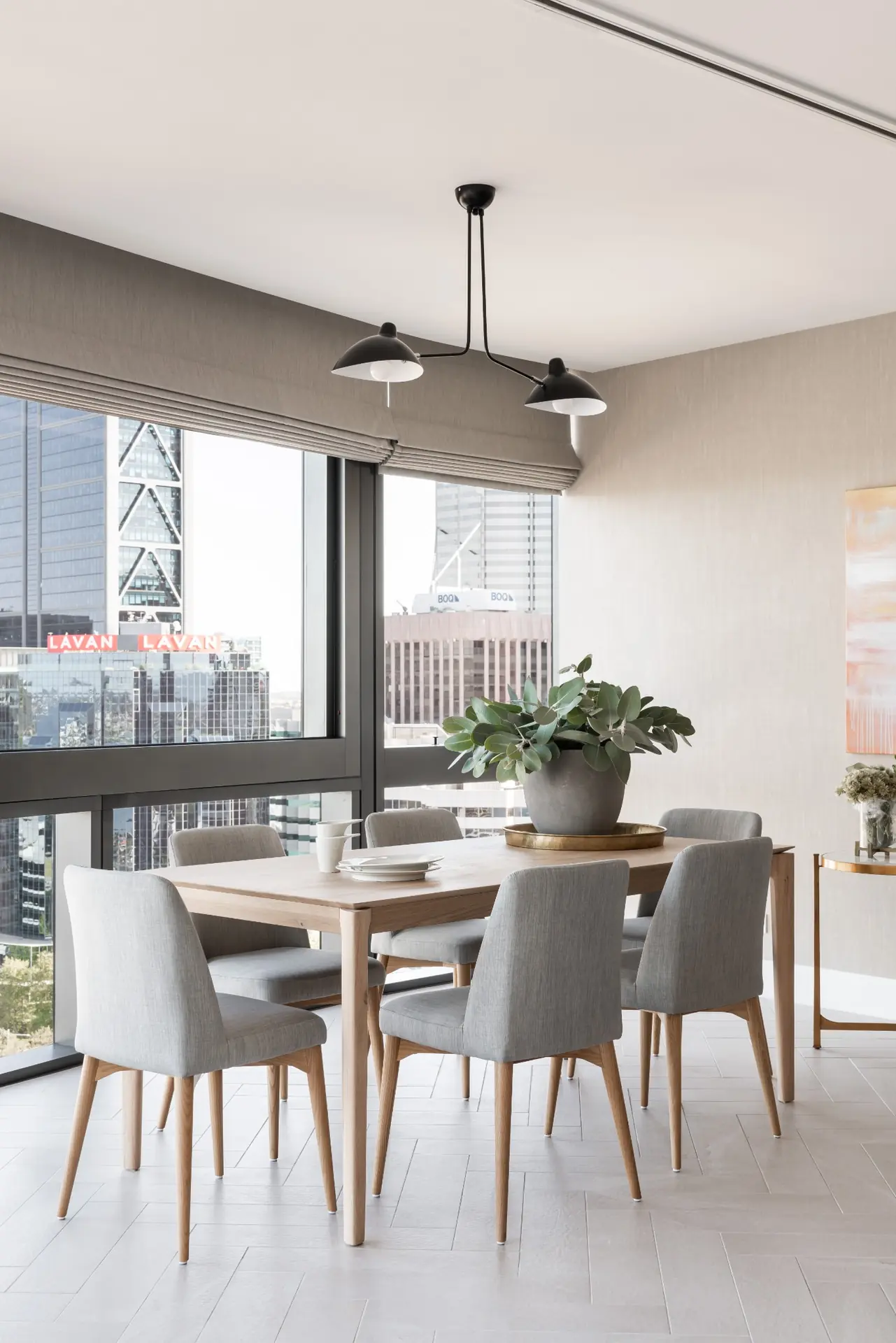 Dining table with pendant lighting in Elizabeth Quay Ritz-Carlton apartment, Perth interior design