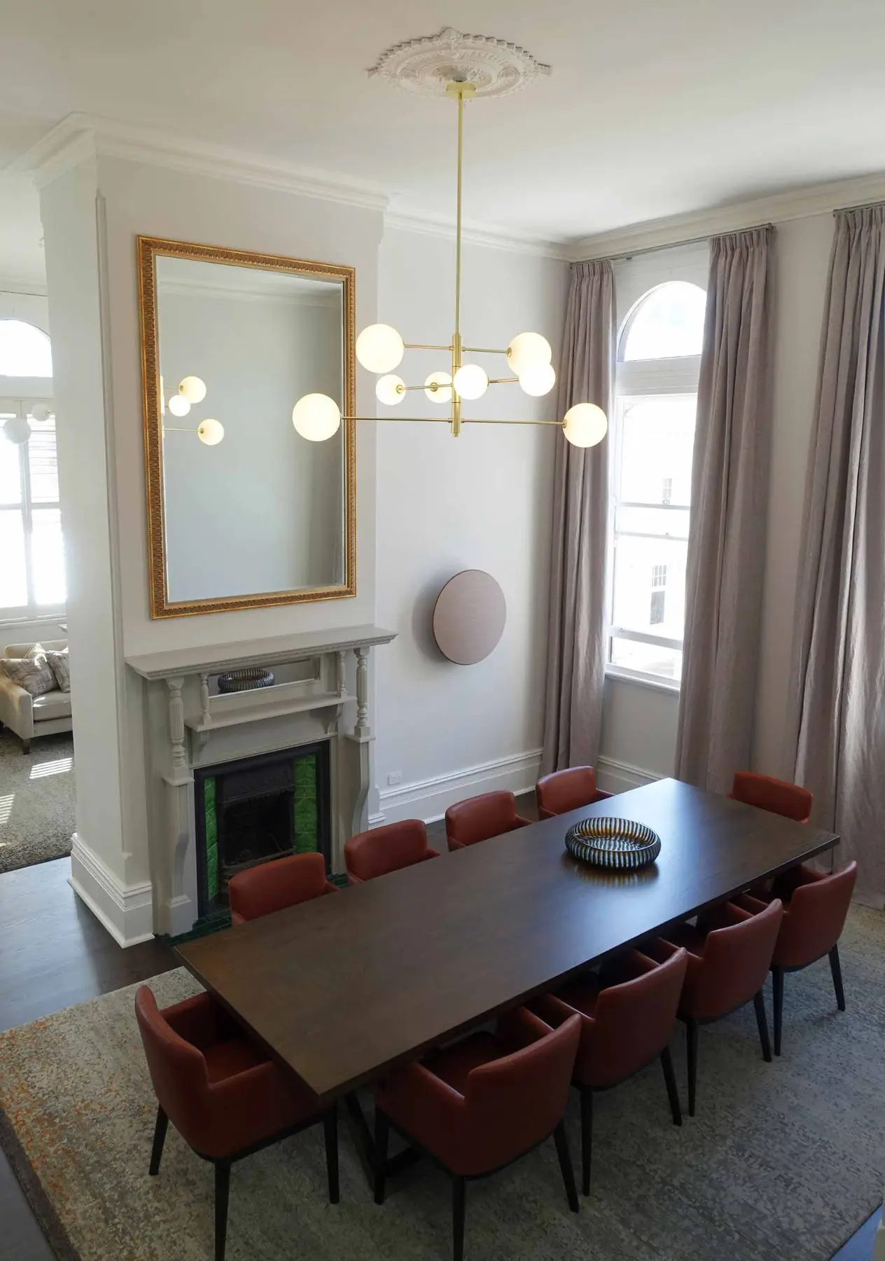 Dining table setting beneath open staircase in Fremantle residence, Perth interior design