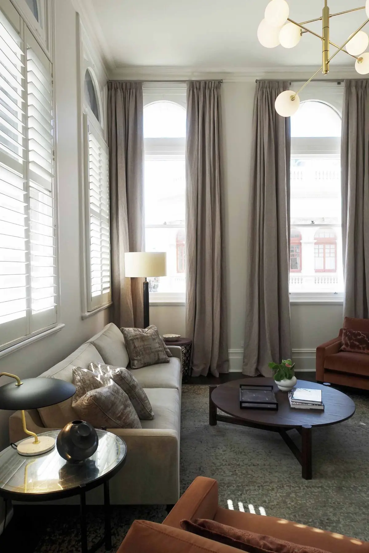 Living room seating with curtained window in Fremantle residence, Perth interior design