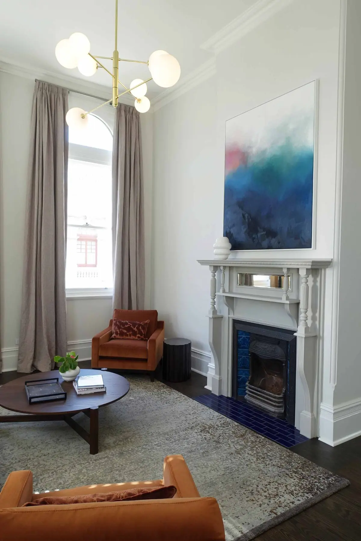 Living room armchair beside fireplace mantel in Fremantle residence, Perth