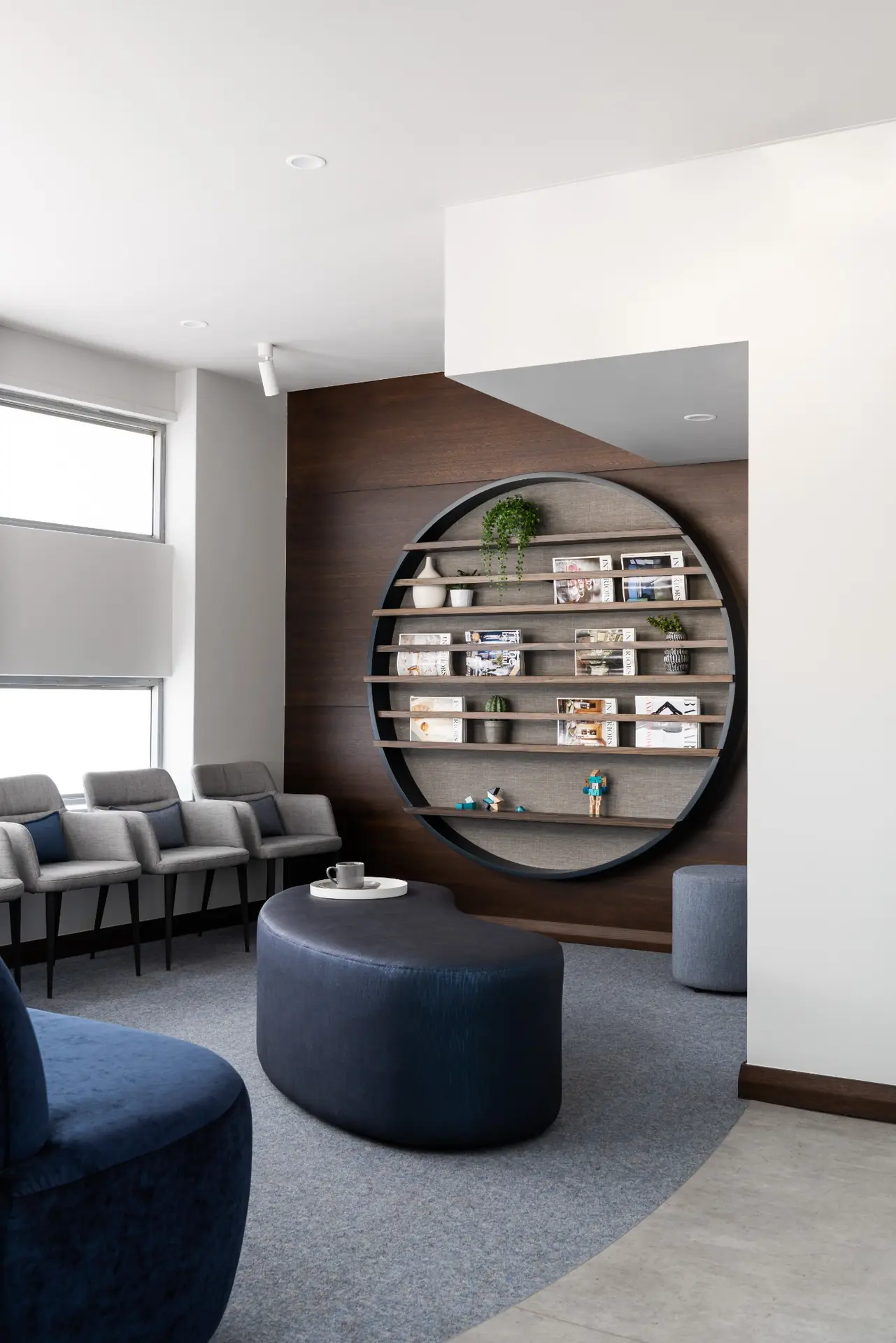 Reception waiting area with circular shelving feature in Profile Orthodontics, Perth commercial interior design