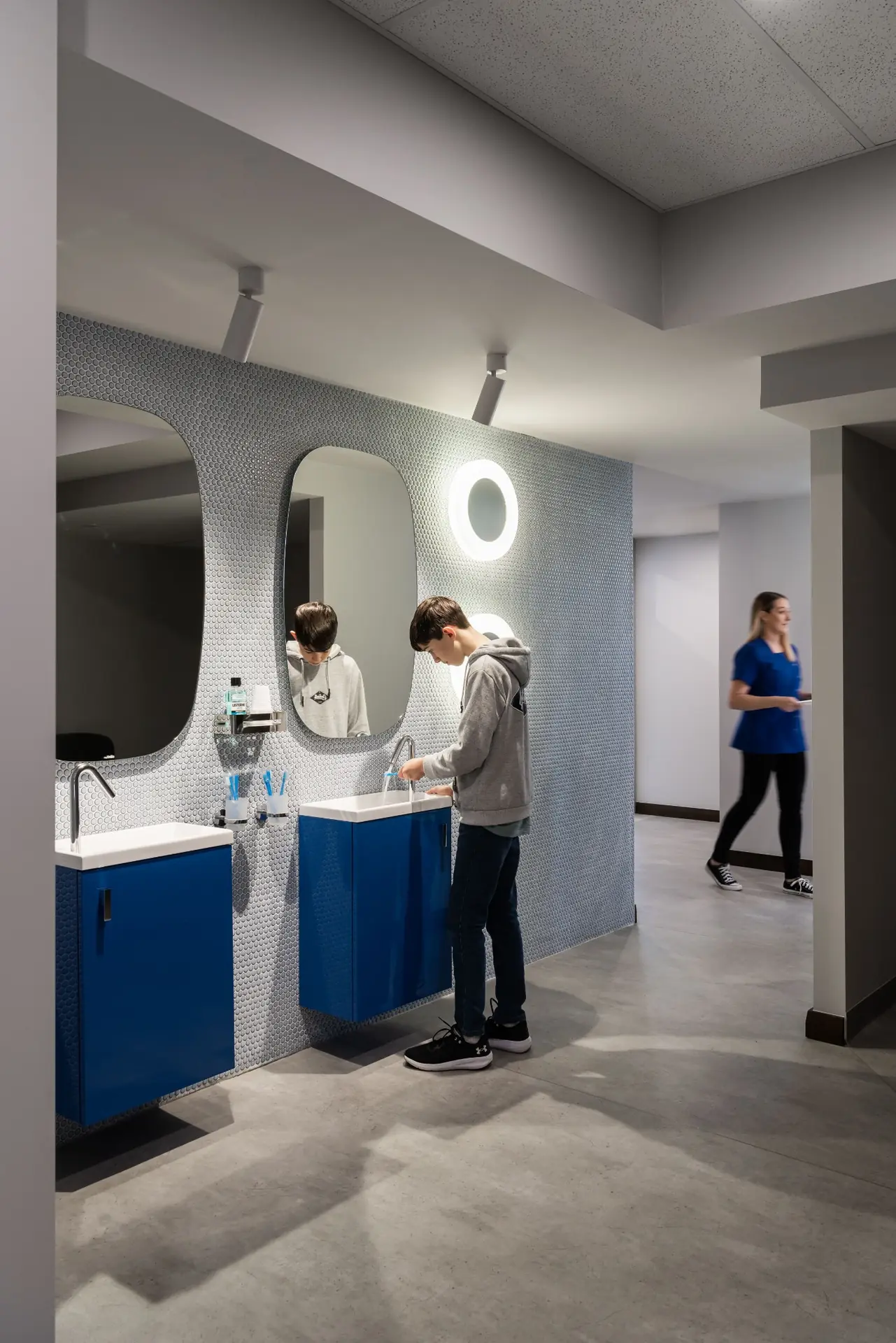 Hallway with blue joinery and consultation rooms in Profile Orthodontics, Perth