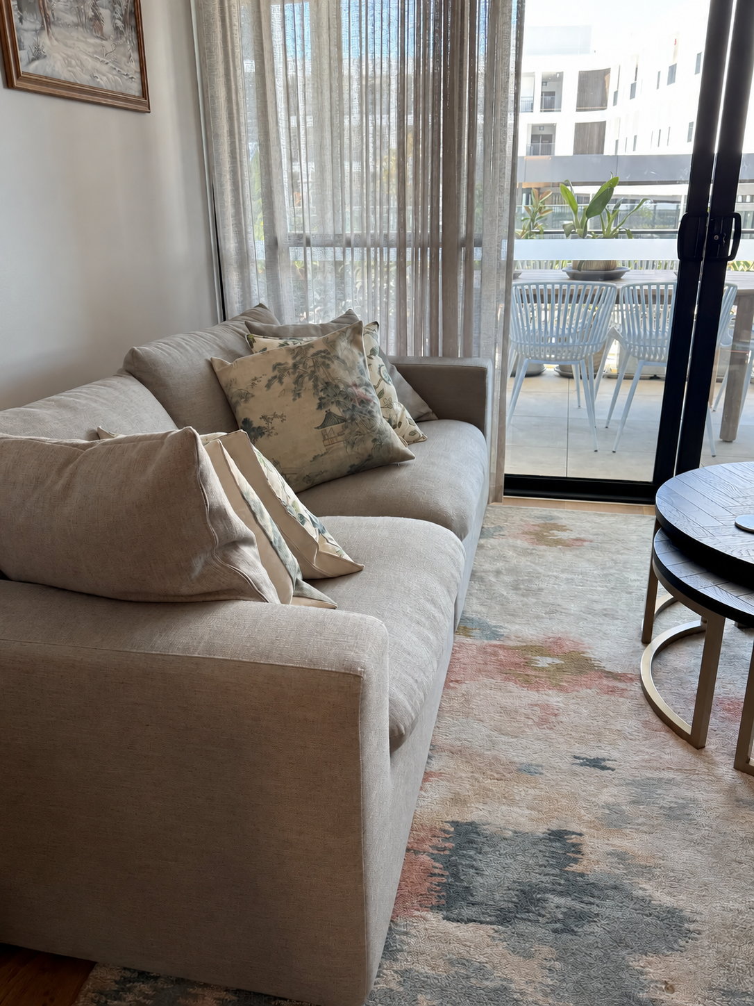 Sitting area with rug and window light in Shenton Quarter apartment, Perth