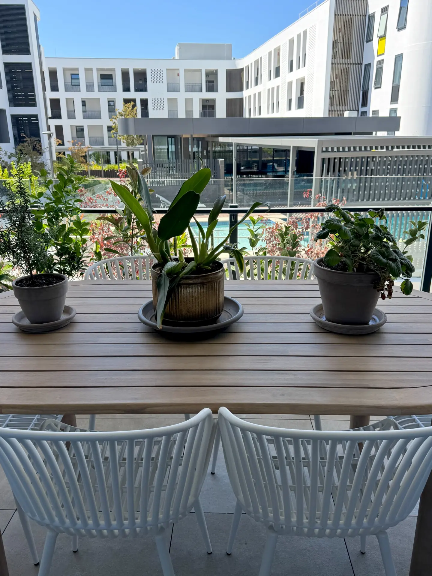 Balcony seating with skyline views in Shenton Quarter apartment, Perth interior design