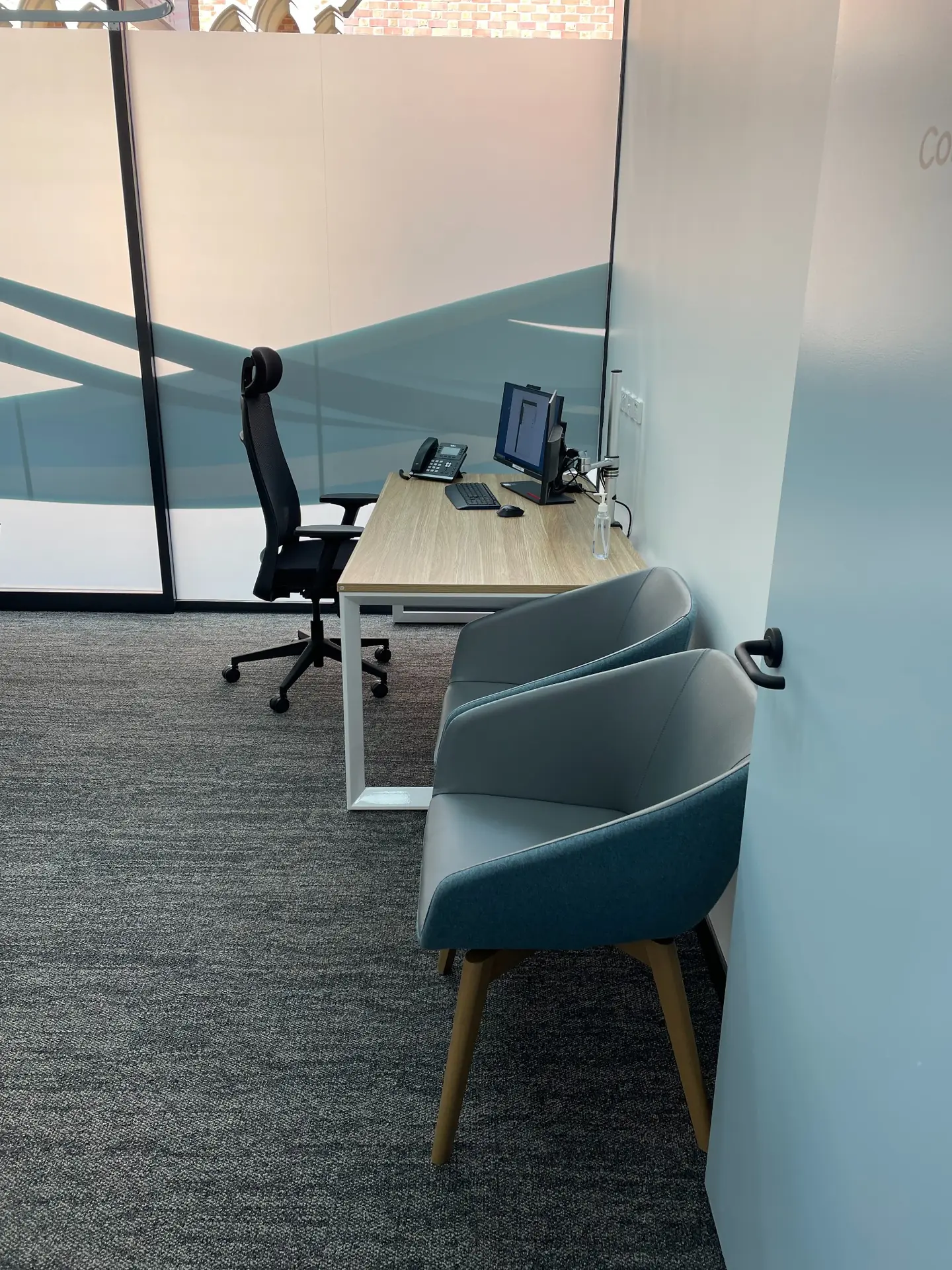 Consultation room with modern desk and chairs in Wesley Quarter Medical Centre, Perth interior design